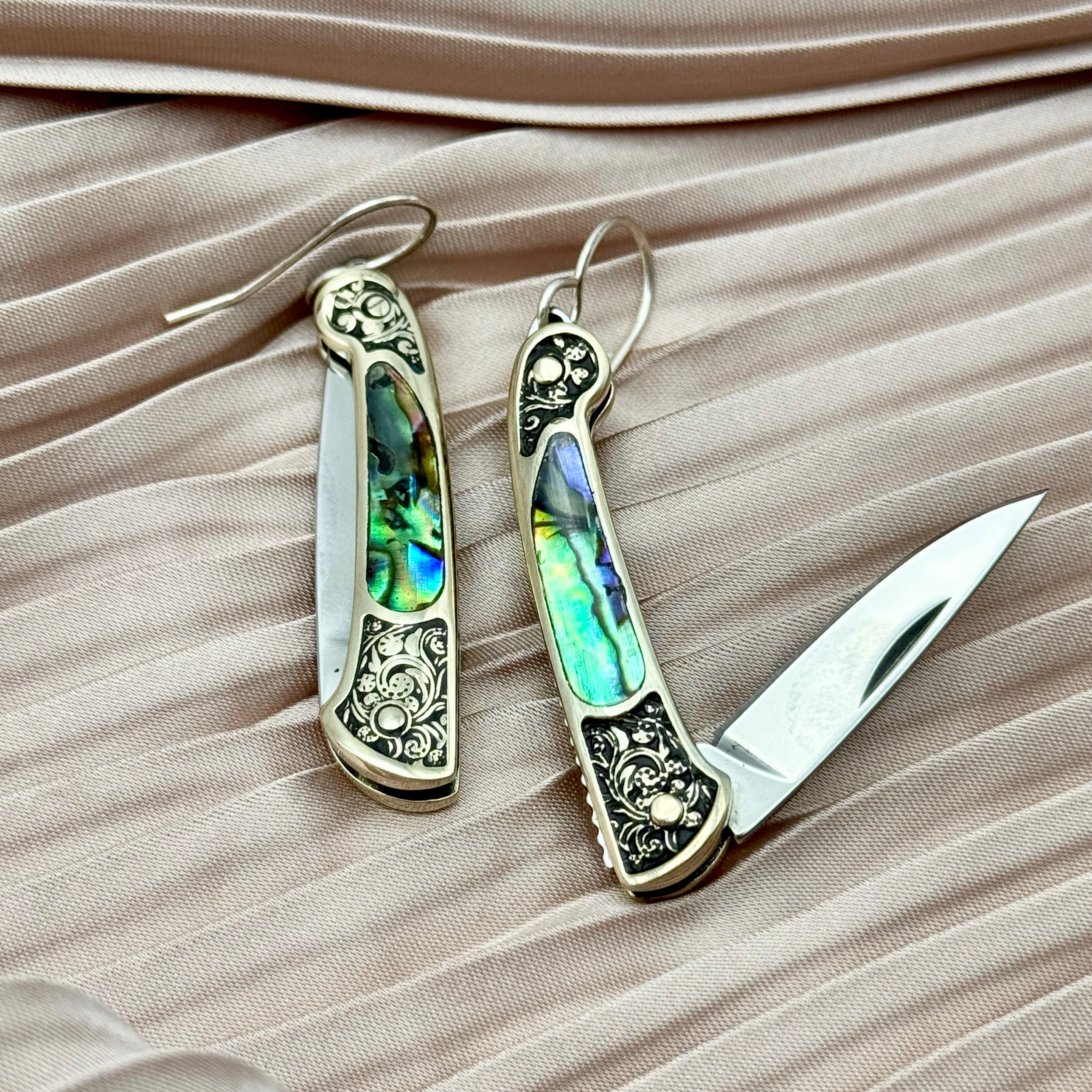Abalone inlay and vintage inspired etched gold handle on a working pocketknife hanging from an ear wire