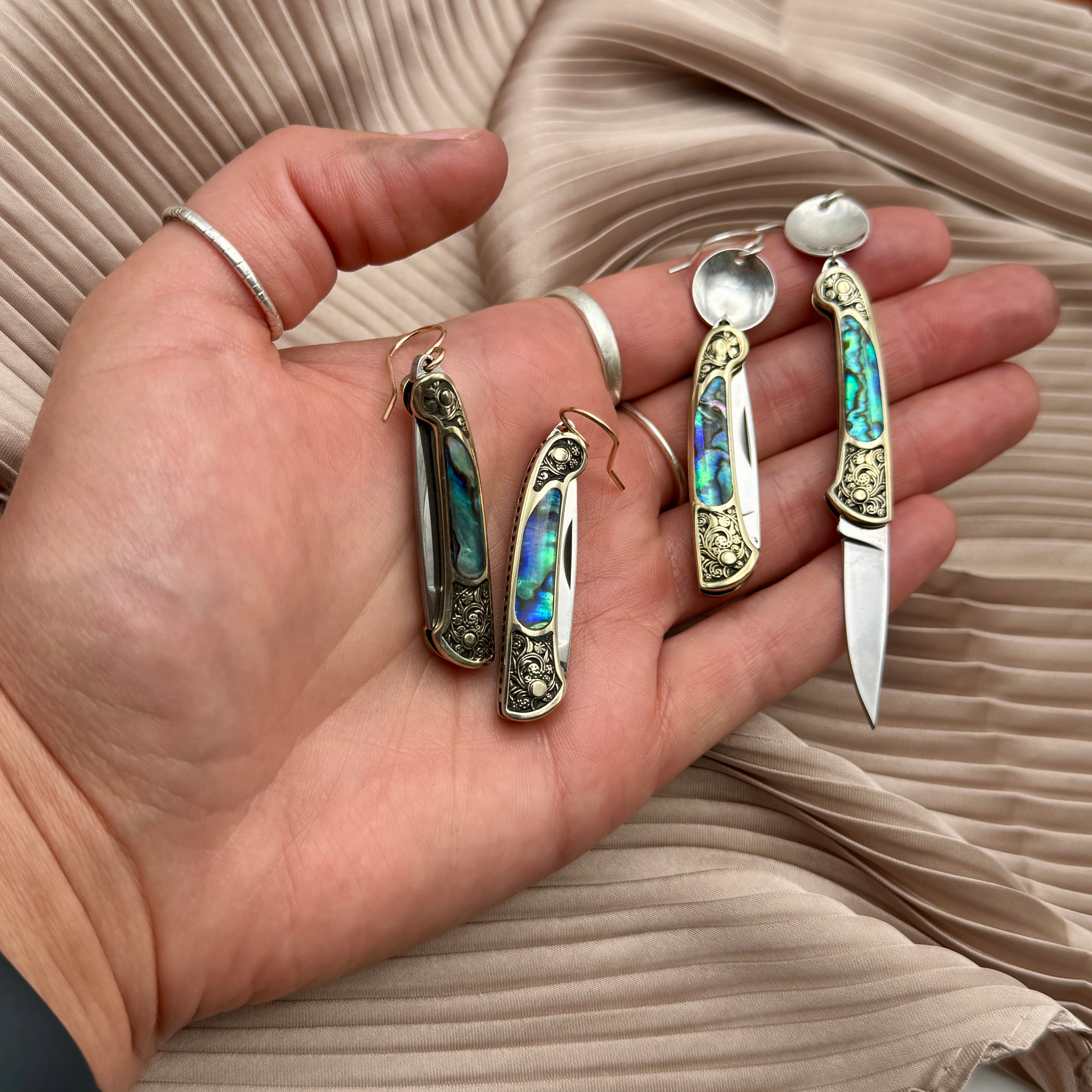 Abalone inlay and vintage inspired etched gold handle on a working pocketknife hanging from an ear wire