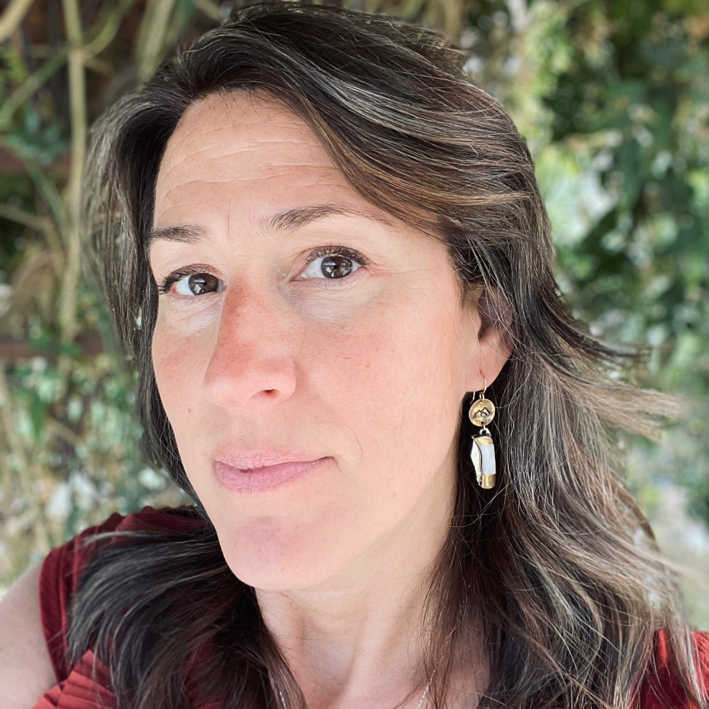 Mini pocket knife with mother of pearl inlay hanging from stamped fish flower mountain or tree circle pendant