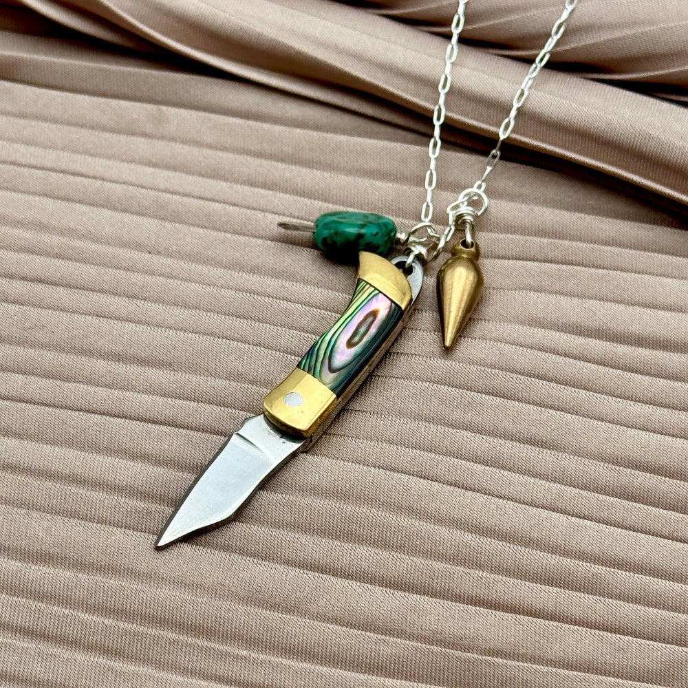 Abalone inlay and gold handle miniature pocketknife hanging with a turquoise stone and mini bullet