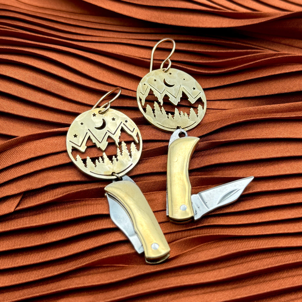 Mountain Night Moon Pine tree pendant hanging from ear wire with miniature billie gold or silver pocketknives