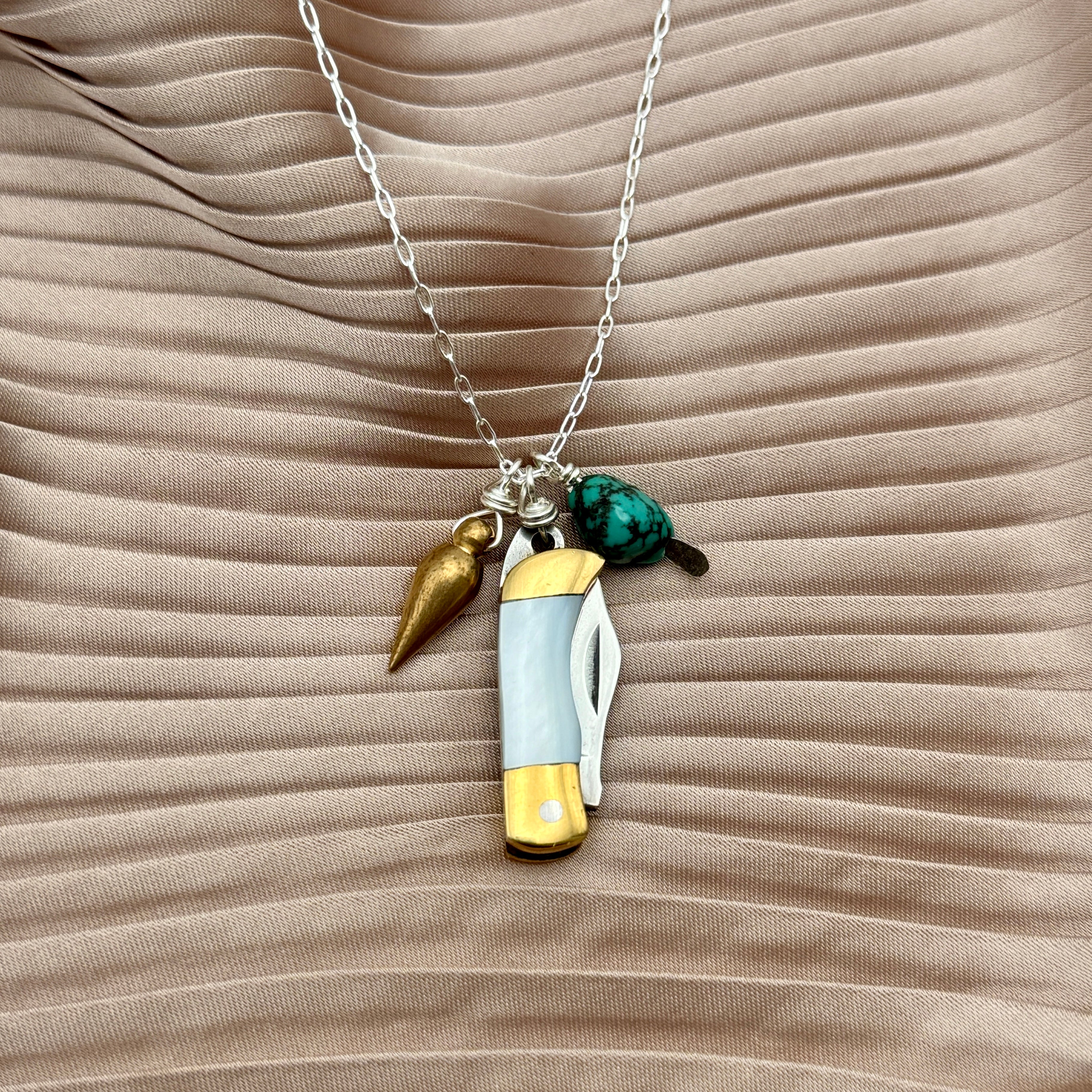 Miniature Pocketknife with mother of pearl inlay and a turquoise stone and mini bullet hanging from sterling silver or gold chain
