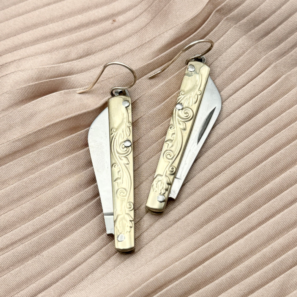 Etched Gold Handle Working PocketKnife hanging from ear wire
