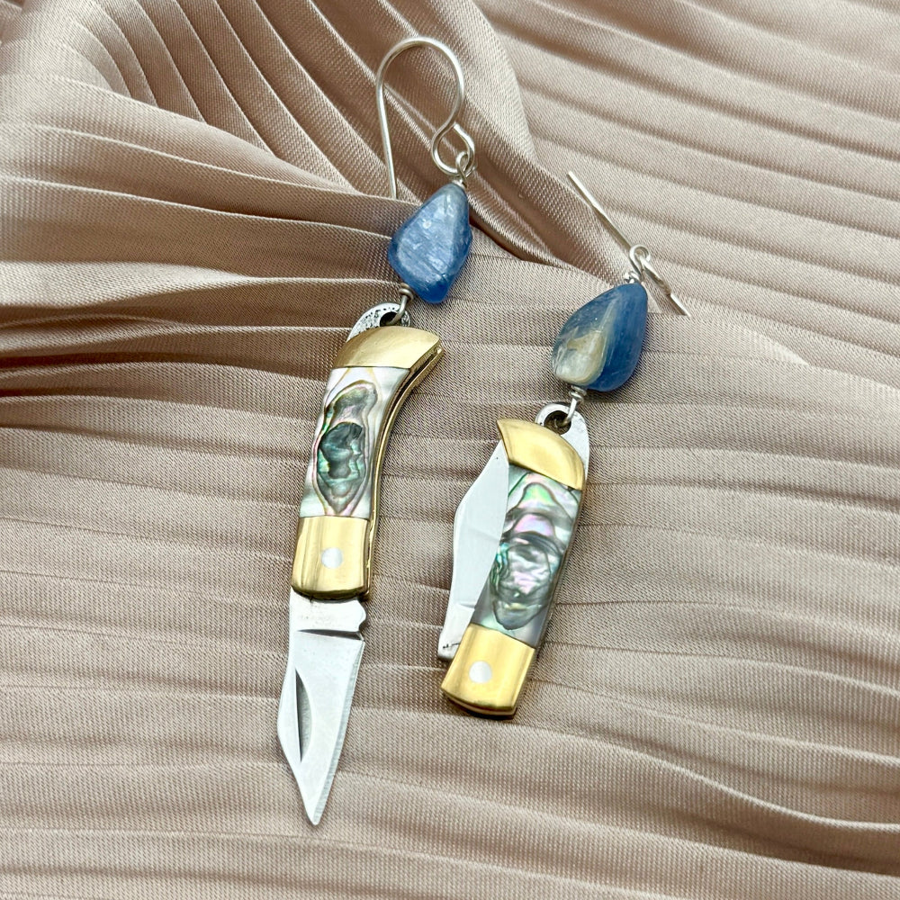 abalone inlay pocket knife pendant with kyanite bead knives open and closed on fabric