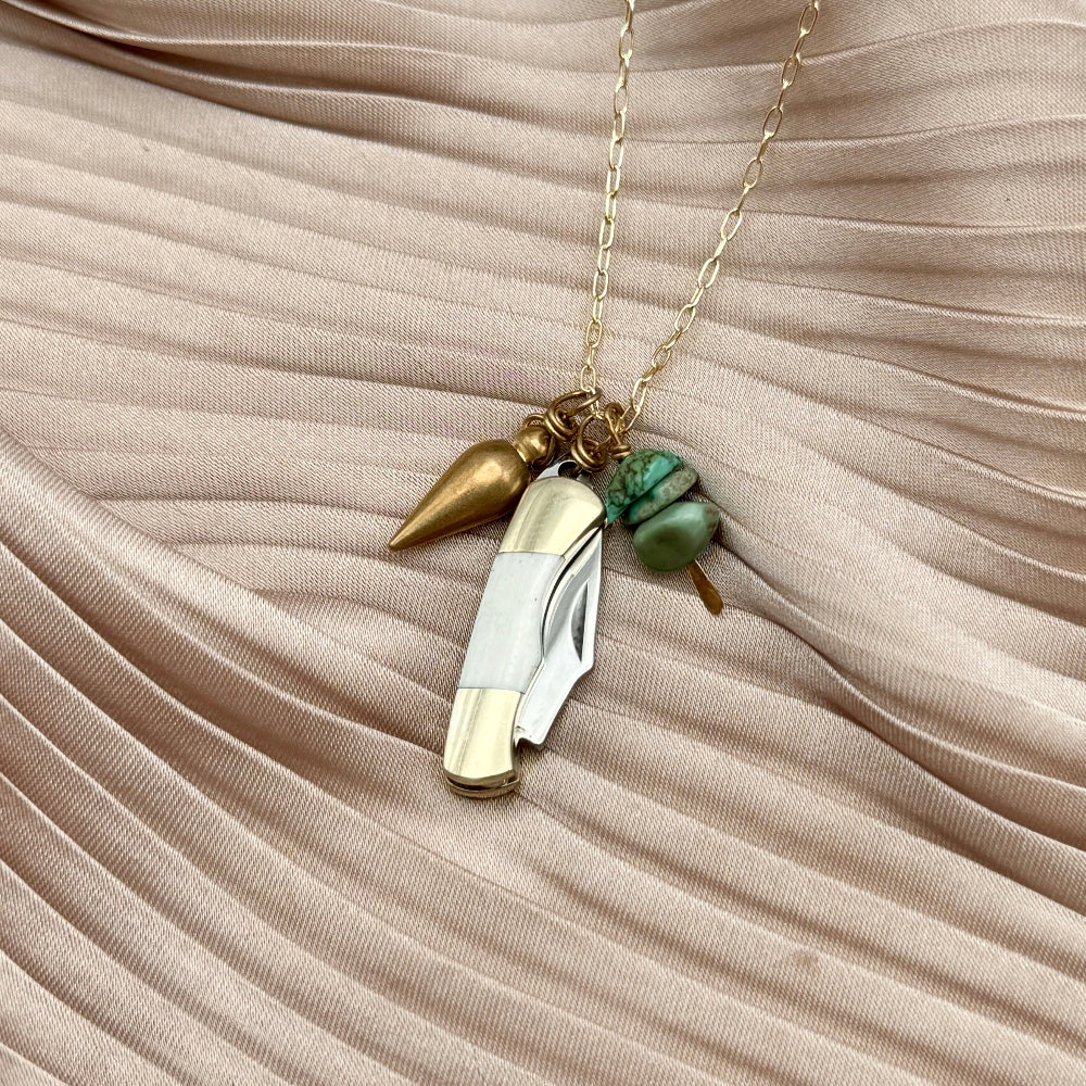 miniature pocket knife necklace with bullet charm and turquoise bead chips on gold chain