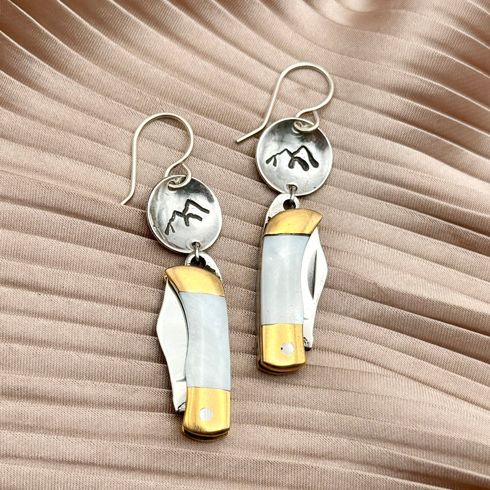 Mini pocket knife with mother of pearl inlay hanging from stamped fish flower mountain or tree circle pendant