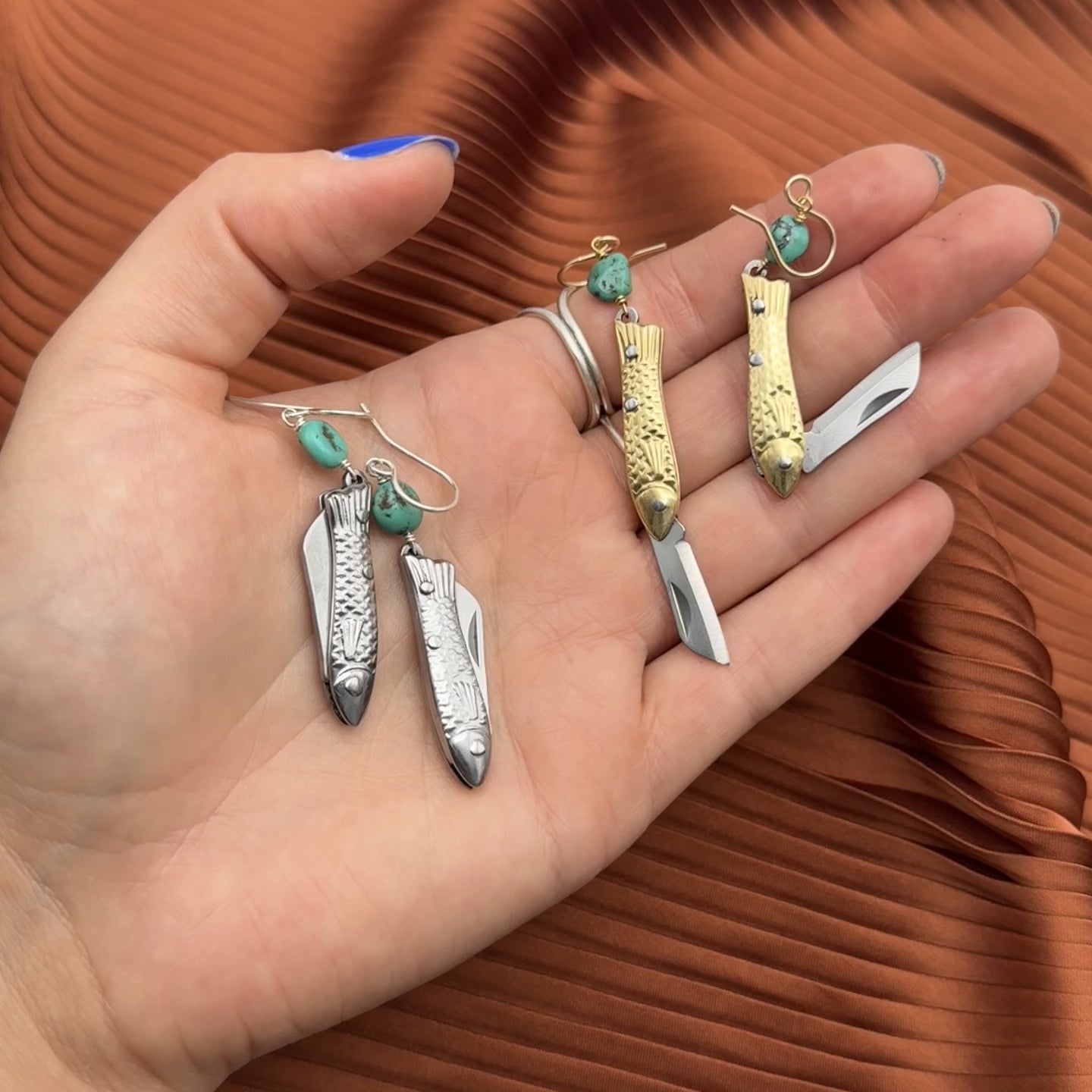 A pair of earrings featuring gold or silver miniature fish shaped utility working pocket knife with or without turquoise nuggets on a sterling silver or 14 karat gold fill ear wire