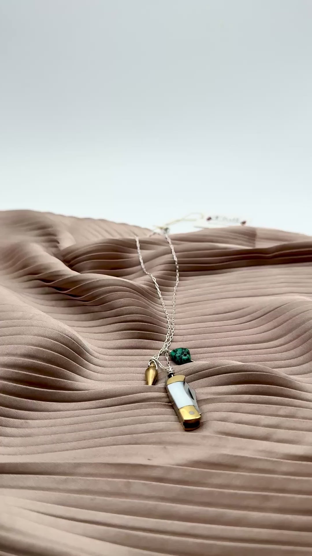 Miniature Pocketknife with mother of pearl inlay and a turquoise stone and mini bullet hanging from sterling silver or gold chain