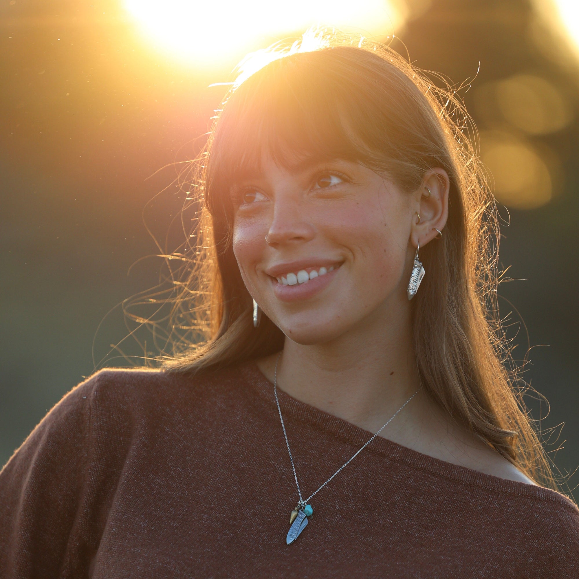 feeesh billie working pocketknife earrings and feeesh billie necklace