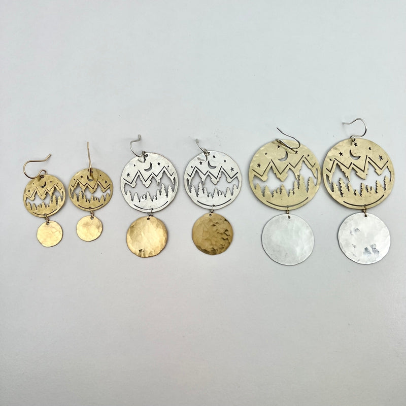gold and silver earrings with mountain silhouette