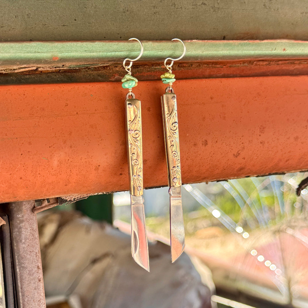 Etched Gold Handle Working PocketKnife hanging from ear wire with turquoise stone