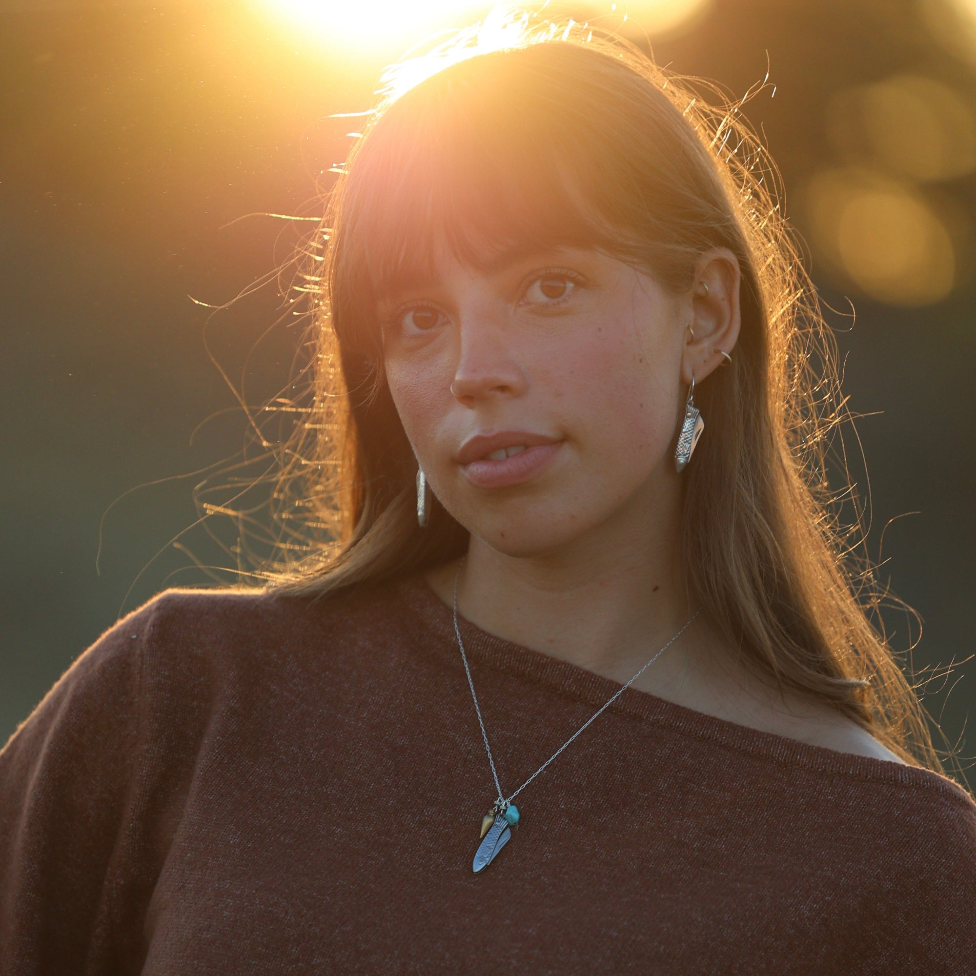 fish shaped pocket knife earrings for outdoor enthusiasts 