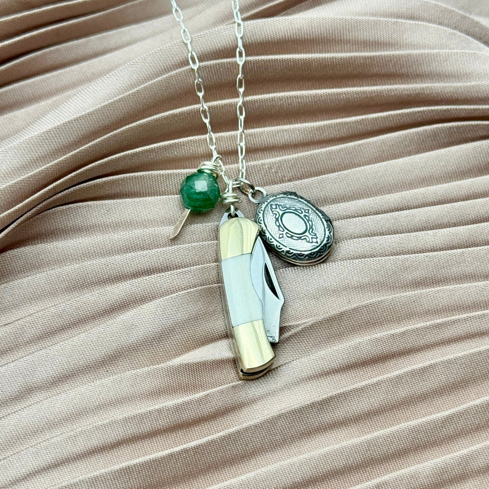 Mini bone pocket knife necklace with locket and emerald stone 