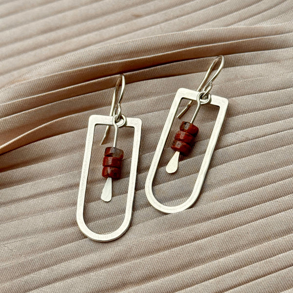 metal hollow arch with three red jasper heishe beads earrings