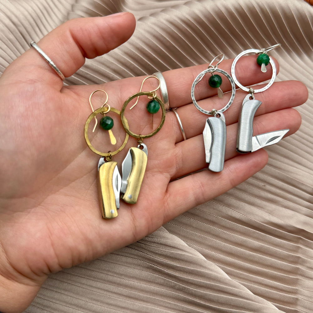 Silver or Gold Metal Billie Knives hanging from circle pendant with emerald bead from ear wire