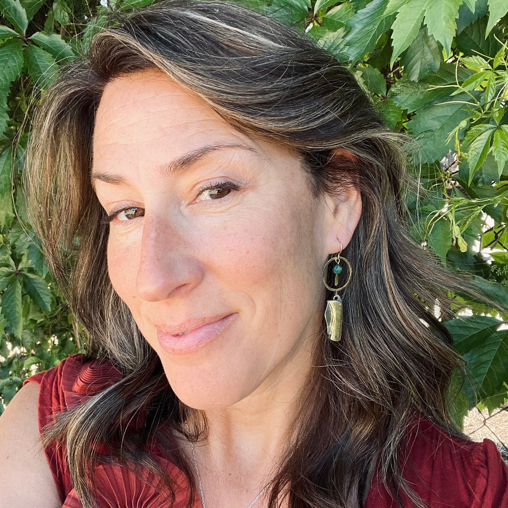 Silver Metal Billie Knives hanging from circle pendant with emerald bead from ear wire