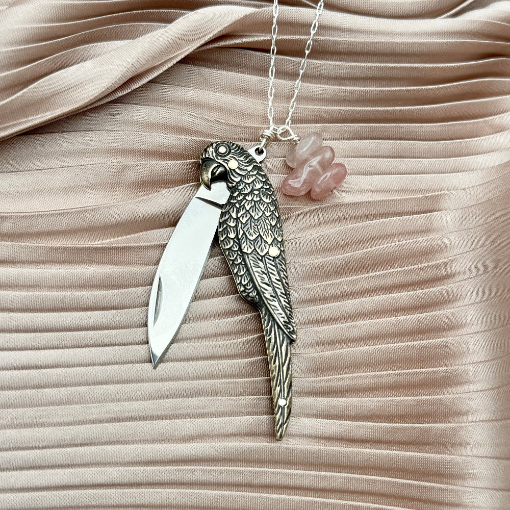 Parrot bird shaped brass pocketknife pendant with rose quartz beads on necklace chain
