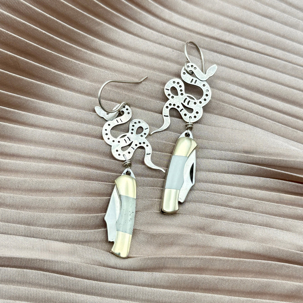 silver snake pendant with bone inlay mini pocketknife hanging from sterling silver ear wire