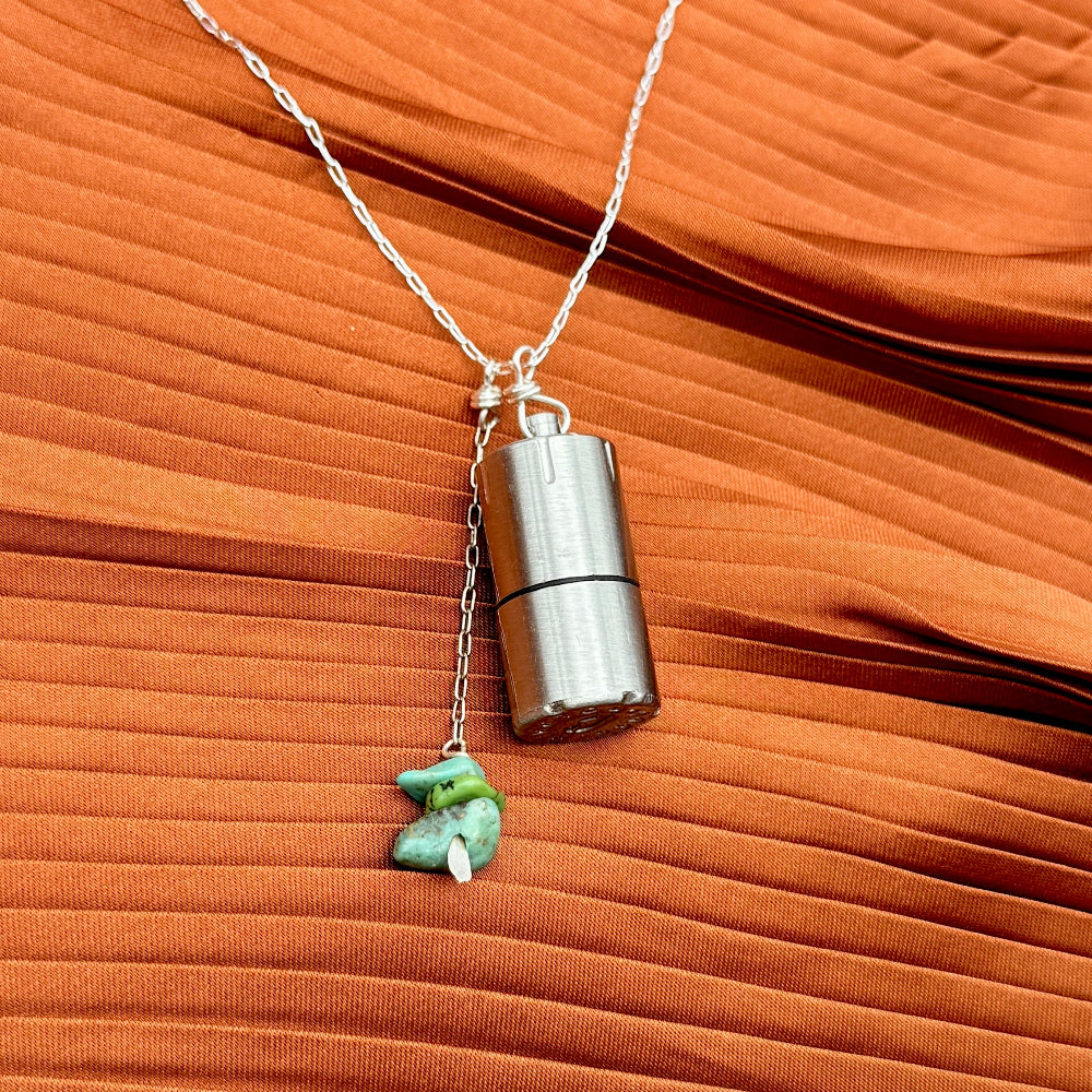 Silver lighter with turquoise stones on a necklace chain