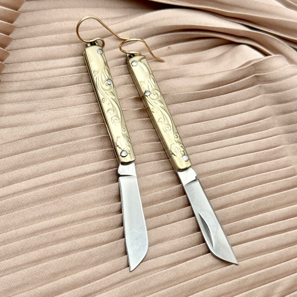 Etched Gold Handle Working PocketKnife hanging from ear wire 