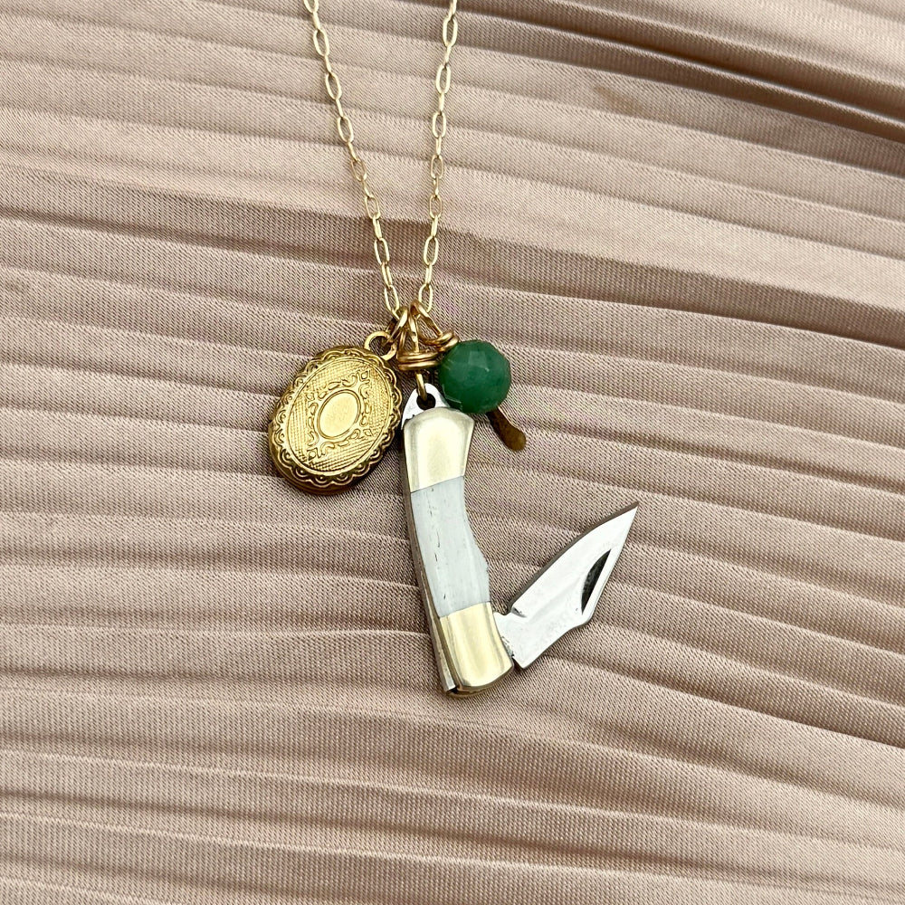 Mini bone pocket knife necklace with locket and emerald stone 