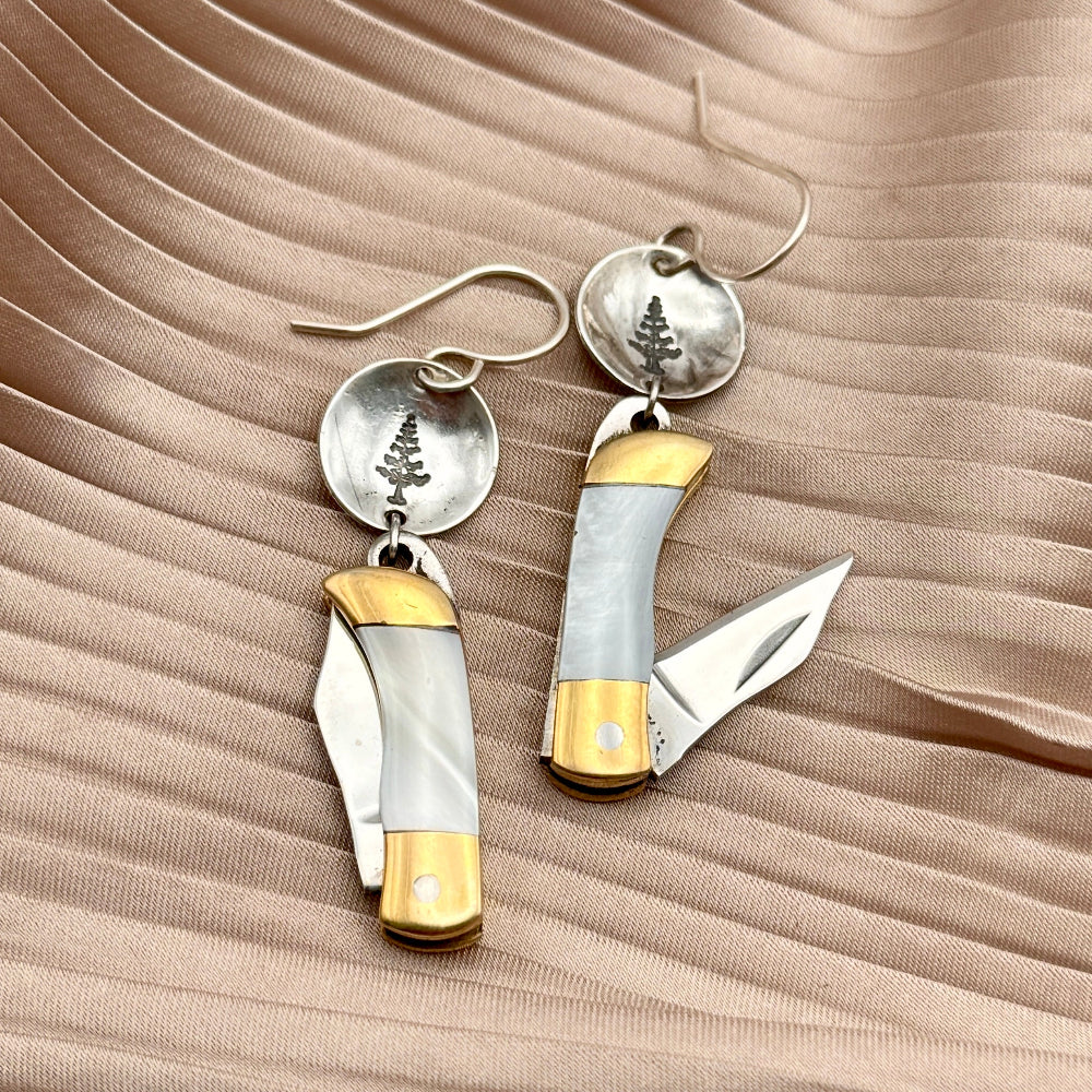 Mini pocket knife with mother of pearl inlay hanging from stamped fish flower mountain or tree circle pendant