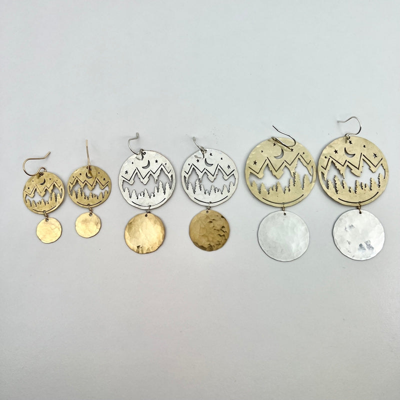 gold and silver earrings with mountain silhouette 