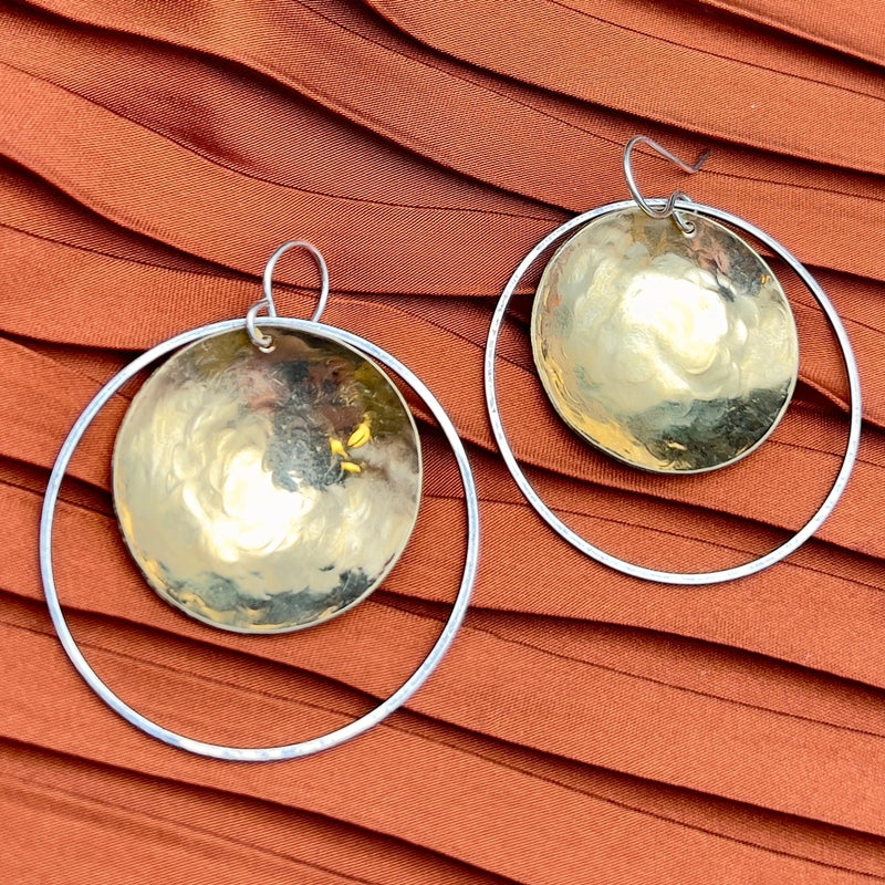 medium sized earrings with brass disk inside a silver hoop